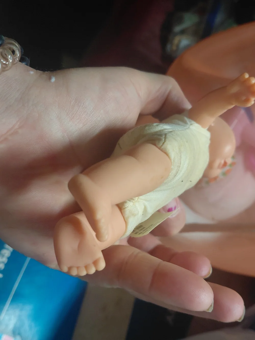 a vintage 1997 Corolle mini baby doll featuring blue eyes and a soft body.
